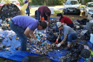 volunteers sorting trash at the Fort River Cleanup 2019